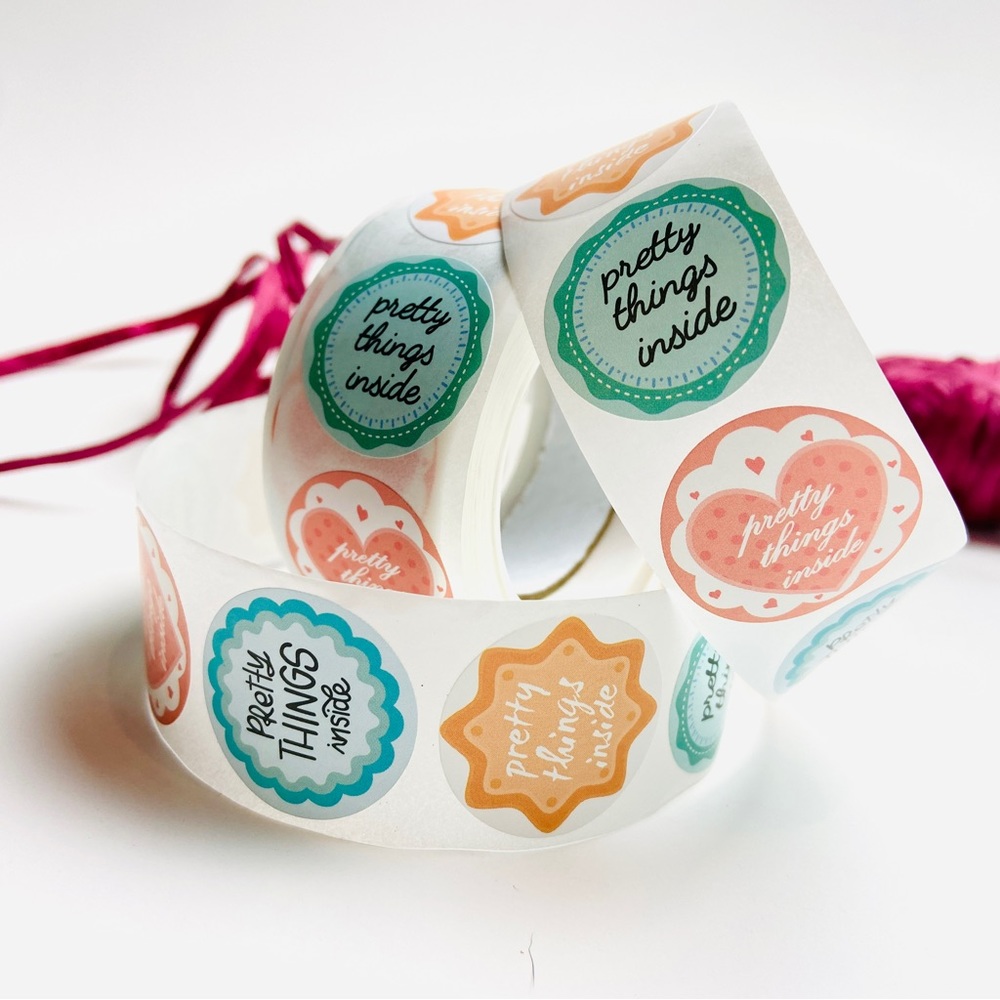 500 qty pretty things inside packaging stickers. 1” round